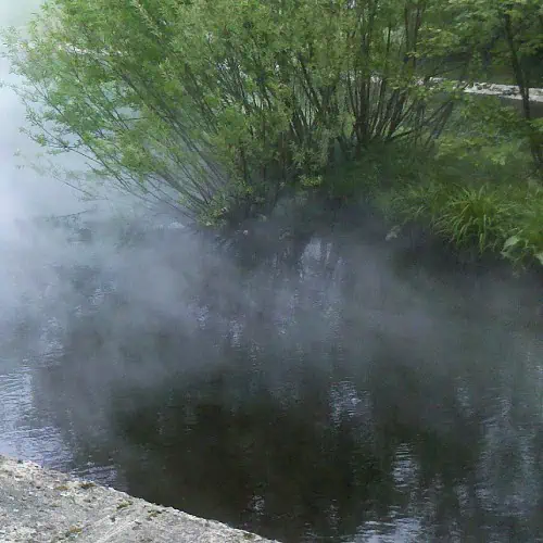 water evaporating from a pond during hot weather